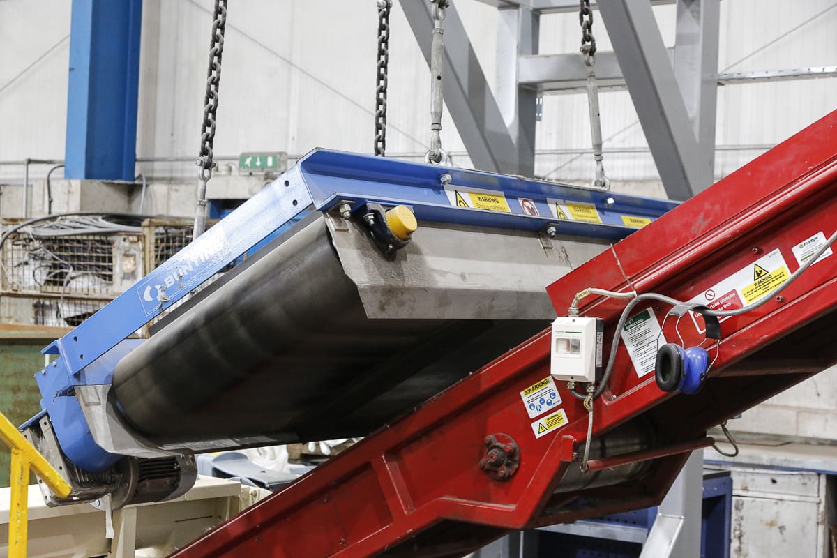 Bunting Permanent Overband Magnet installed above a bulk material conveyor
