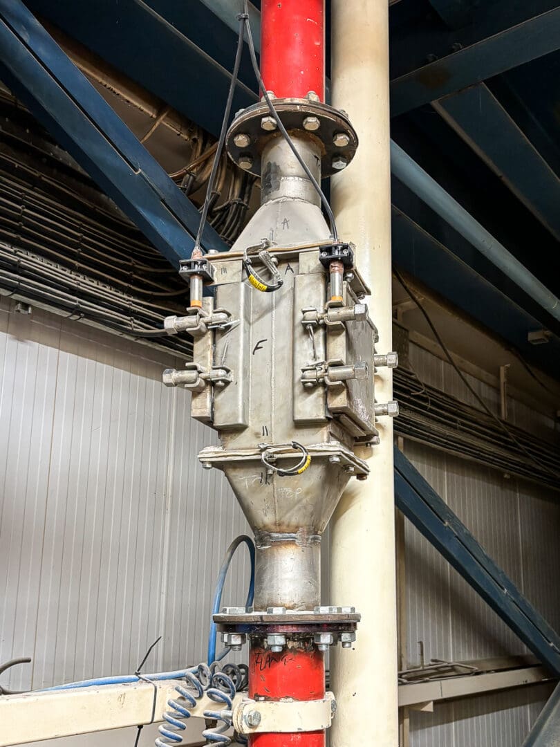 Bunting Pneumatic Inline Magnet installed in a bulk solids conveying system